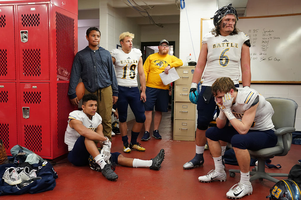 Battle's defensive players Isaak Smith, Lorenzo Borsari, Chase Anderson, and Tommy Atherton, gather in the locker room at halftime